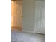 Bedroom featuring neutral walls, carpet, white door, baseboards, and closet for plenty of storage at 309 Gladstone Dr, Durham, NC 27703