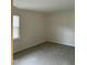 Standard bedroom with neutral carpet and walls, with a window to provide the room with natural light at 309 Gladstone Dr, Durham, NC 27703