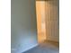 Neutral bedroom with an open white door leading to an adjacent room with matching neutral walls at 309 Gladstone Dr, Durham, NC 27703