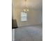 Bright dining area features neutral carpet, a chandelier, and an open view into the kitchen with a convenient breakfast bar at 309 Gladstone Dr, Durham, NC 27703