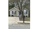 Charming single-story home featuring a well-maintained lawn, classic shutters, and a welcoming front entrance at 309 Gladstone Dr, Durham, NC 27703
