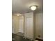 Hallway with multiple storage closets and flush mount lighting throughout the home at 309 Gladstone Dr, Durham, NC 27703