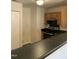 Functional kitchen featuring stainless steel appliances, a breakfast bar, and ample cabinet space at 309 Gladstone Dr, Durham, NC 27703