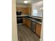 Well-equipped kitchen with stainless steel oven and dishwasher, warm wood cabinetry and dark countertops at 309 Gladstone Dr, Durham, NC 27703