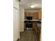 Well-lit kitchen features stainless steel oven, black countertops and ample wood cabinetry at 309 Gladstone Dr, Durham, NC 27703