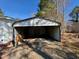 Outside, a metal carport protects vehicles from the elements at 328 Cone Dr, Henderson, NC 27537