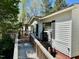 Wooden deck and ramp leading to the home at 328 Cone Dr, Henderson, NC 27537
