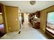 Open floor plan with a kitchen, dining area, and hallway offering seamless transition and functionality at 328 Cone Dr, Henderson, NC 27537