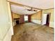 The spacious living room features a fireplace, ceiling fan, and neutral color palette at 328 Cone Dr, Henderson, NC 27537