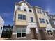 New construction two-story home featuring modern design, large windows, and a brick foundation, enhancing its curb appeal at 336 Chesapeak Commons St # 140, Garner, NC 27529