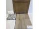 Interior finish samples showcasing a cabinet, countertop, backsplash, and flooring at 336 Chesapeak Commons St # 140, Garner, NC 27529