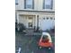 Exterior of home shows manicured bushes and trees with a lawn and attached garage at 3742 Marshlane Way, Raleigh, NC 27610