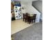 Cozy kitchen and dining area featuring wood cabinets, stainless refrigerator, and wooden dining set at 3742 Marshlane Way, Raleigh, NC 27610