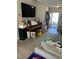 Cozy living room featuring carpet floors and a piano, adjacent to the front entrance at 3742 Marshlane Way, Raleigh, NC 27610