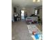 Carpeted living room featuring a piano, sofa, and view of the front entry and stairs at 3742 Marshlane Way, Raleigh, NC 27610