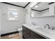 Bathroom featuring double sink vanity, large mirror, and modern fixtures providing a comfortable and stylish space at 409 S 13Th St, Lillington, NC 27546