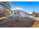Charming one-story home with a covered porch and a partially screened patio addition at 409 S 13Th St, Lillington, NC 27546