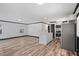 An open-concept living space with hardwood floors flowing into the kitchen at 409 S 13Th St, Lillington, NC 27546