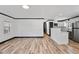 Open-concept living space with hardwood floors that seamlessly flows into the modern kitchen at 409 S 13Th St, Lillington, NC 27546