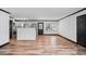 Spacious living room with hardwood floors and easy access to the kitchen and backyard at 409 S 13Th St, Lillington, NC 27546