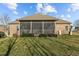 Home's screened-in porch offers an ideal outdoor space, complemented by a well-maintained lawn at 4278 Aviemore, Burlington, NC 27215