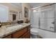 This bathroom features a granite countertop, a white sink and cabinet, and a shower and bathtub at 4278 Aviemore, Burlington, NC 27215