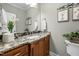 This bathroom features a granite countertop, a white sink and cabinet, and neutral colored walls at 4278 Aviemore, Burlington, NC 27215