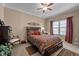 Comfortable bedroom featuring warm tones, a ceiling fan, and a cozy atmosphere at 4278 Aviemore, Burlington, NC 27215