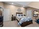 Cozy bedroom with a decorative wall hanging, a nightstand with lamp, and a comfortable-looking bed at 4278 Aviemore, Burlington, NC 27215