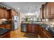 Open concept kitchen with stainless steel appliances, hardwood floors, and modern fixtures at 4278 Aviemore, Burlington, NC 27215