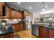 Modern kitchen with stainless steel appliances, hardwood floors, and ample cabinet space at 4278 Aviemore, Burlington, NC 27215