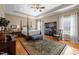 This main bedroom features a four poster bed, wood floors, neutral walls, and a tray ceiling at 4278 Aviemore, Burlington, NC 27215