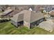Aerial view of backyard with a screened-in porch and neatly trimmed lawn showcasing privacy and outdoor enjoyment at 4278 Aviemore, Burlington, NC 27215