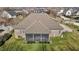 Aerial view of backyard with a screened-in porch and neatly trimmed lawn showcasing privacy and outdoor enjoyment at 4278 Aviemore, Burlington, NC 27215