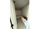 Bright bathroom featuring a white tub-shower and white cabinets awaiting countertops for added functionality and storage at 432 E Clydes Point Way, Wendell, NC 27591