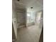 Unfinished bathroom with shower stall and large soaking tub next to a window at 432 E Clydes Point Way, Wendell, NC 27591