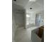 Bathroom shows shower and tub next to an unfinished cabinet at 432 E Clydes Point Way, Wendell, NC 27591
