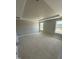Spacious bedroom with tray ceiling, two windows, and neutral walls offer a serene blank canvas for personalization at 432 E Clydes Point Way, Wendell, NC 27591