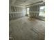 Spacious bedroom with unfinished drywall and two bright, sunlit windows at 432 E Clydes Point Way, Wendell, NC 27591