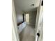 Hallway showcasing cabinetry, fresh paint, and neutral color palette, with doors leading to other rooms at 432 E Clydes Point Way, Wendell, NC 27591