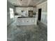 Spacious kitchen with white cabinets and a central island under construction at 432 E Clydes Point Way, Wendell, NC 27591