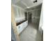 Small kitchenette with white cabinets and an unfinished countertop at 432 E Clydes Point Way, Wendell, NC 27591