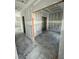 Unfinished living room with natural light and drywall ready for customization and personalization at 432 E Clydes Point Way, Wendell, NC 27591