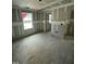 Unfinished living room featuring drywall, natural light and open space for custom design at 432 E Clydes Point Way, Wendell, NC 27591