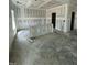 Spacious unfinished living room with drywall and ample natural light ready for customization at 432 E Clydes Point Way, Wendell, NC 27591