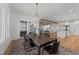 Open floor plan showcases dining area flowing into the kitchen and living room, with exposed wood beams at 4501 Bartlett Dr, Raleigh, NC 27609