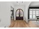 Elegant entryway boasts beautiful wood floors, an arched doorway and a stunning double door entry at 4501 Bartlett Dr, Raleigh, NC 27609