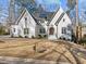 Lovely exterior view of a white brick home with dark roofing and manicured front lawn at 4501 Bartlett Dr, Raleigh, NC 27609