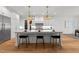 Spacious kitchen with a large island, stainless steel appliances, and modern pendant lighting at 4501 Bartlett Dr, Raleigh, NC 27609