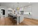 Bright and airy kitchen featuring a large center island, modern appliances and hardwood floors at 4501 Bartlett Dr, Raleigh, NC 27609
